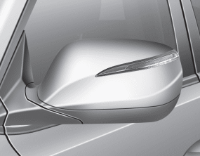 Hyundai Santa Fe: Outside rearview mirror. To fold outside rearview mirror, grasp the housing of mirror and then fold it
