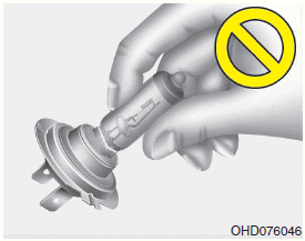 Hyundai Santa Fe: Headlamp, Front position lamp, Front turn signal lamp, Front fog lamp bulb replacement. WARNING - Halogen bulbs