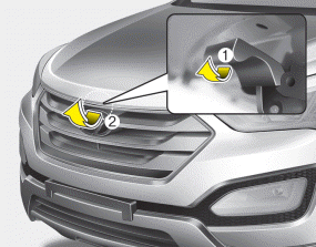 Hyundai Santa Fe: Opening the hood. 2. Go to the front of the vehicle, raise the hood slightly, pull the secondary