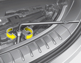 Hyundai Santa Fe: Removing and storing the spare tire. 3. Connect the socket and wheel lug nut wrench.