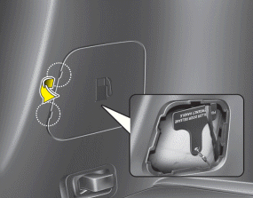 Hyundai Santa Fe: Emergency fuel filer door release. If the fuel filler door does not open using the remote fuel filler door release,