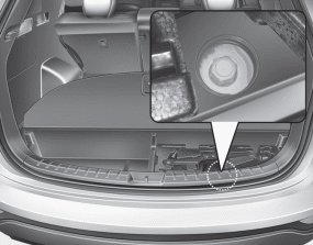 Hyundai Santa Fe: Removing and storing the spare tire. Your spare tire is stored underneath your vehicle, directly below the cargo area.